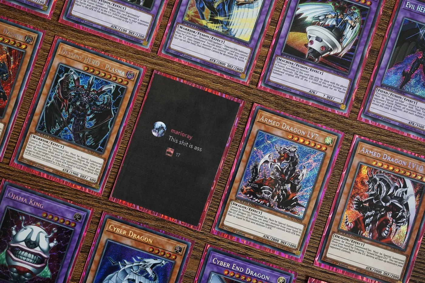 Yu-Gi-Oh trading card grid layout with an embedded community chat screenshot